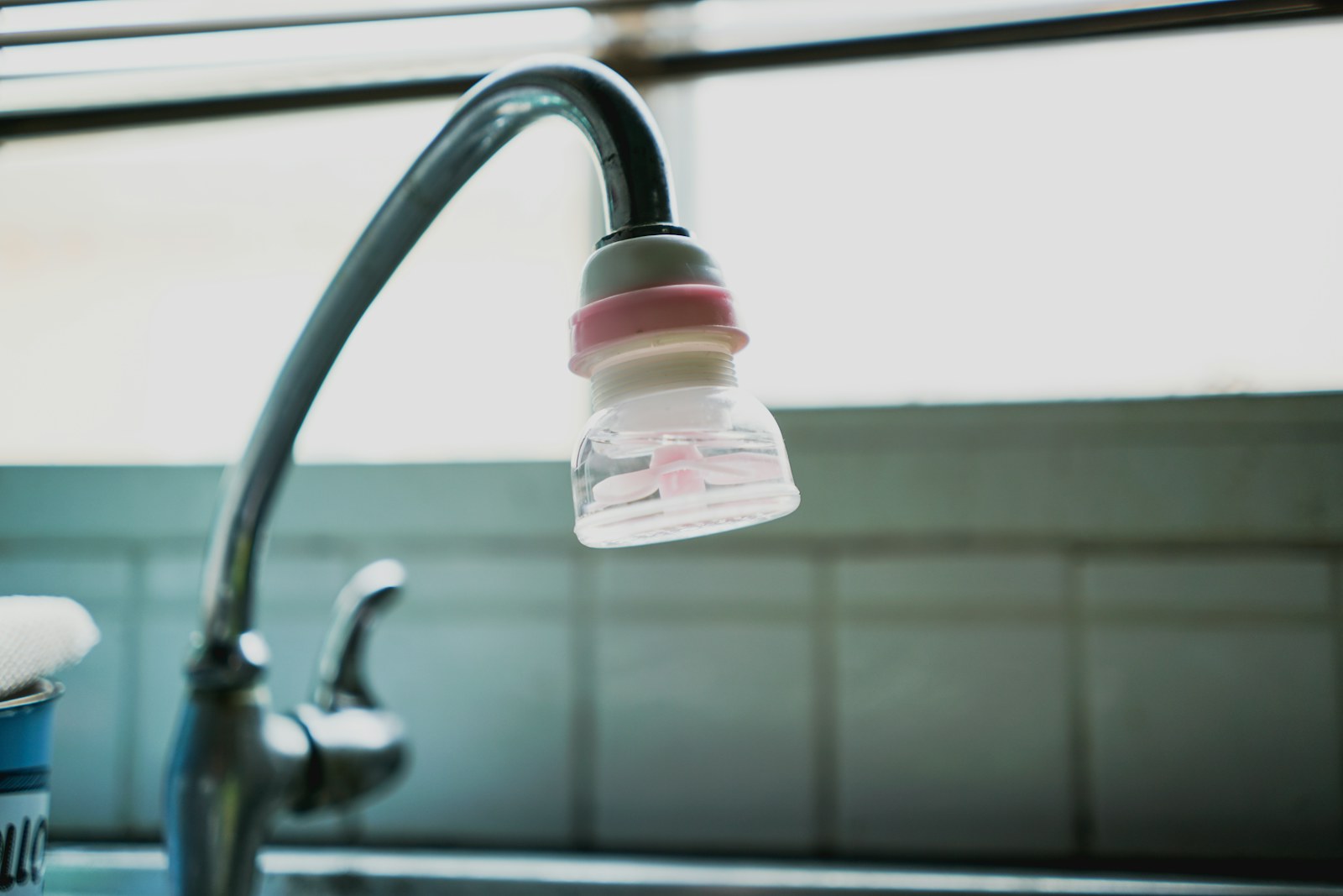 An attachment on a kitchen faucet