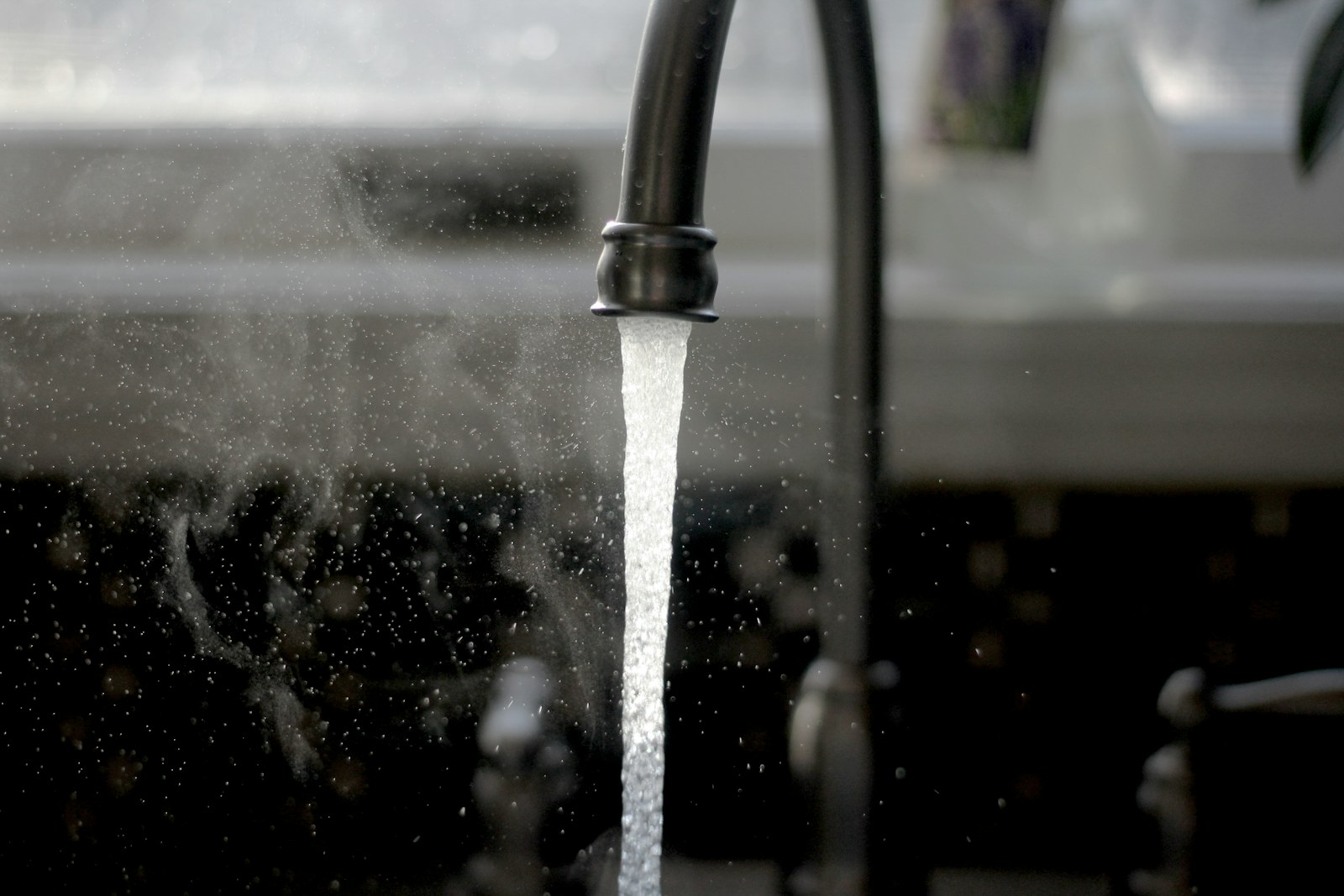 Water flowing from a kitchen faucet
